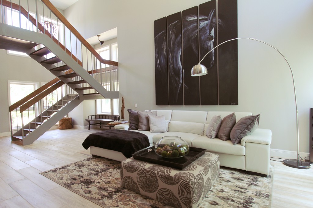 Sleek lines and larger than life art give this grand living room pizazz 